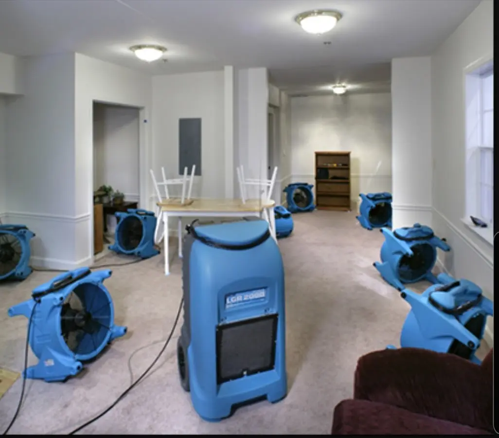 Air movers and dehumidifier setup for Water Damage Restoration in Bern